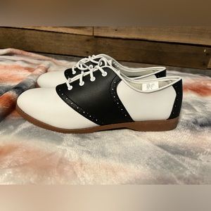 Black and white saddle shoes